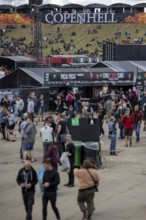 Copenhagen, Denmark - 19 June 2024: Festivalgoers in front of the logo at the Copenhell Metal