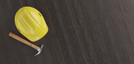 Overhead of yellow hard hat and hammer on a wood surface with room for text