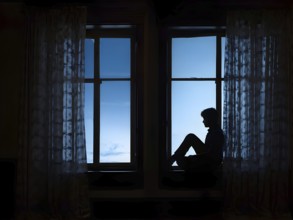 Lonely man lost in the realm looking out of a weathered window as symbol for loneliness, AI