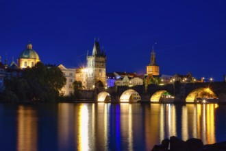 Charles Bridge (Karluv Most) on the Vltava River and Old Town Bridge Tower, at night, Prague, Czech