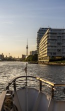 View from the Spree to an apartment building at the East Side Galery and the TV tower on the