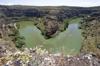 Loop of the Rio Duratón, canoes on the water, on the left the Franciscan monastery of La Hoz, Hoces