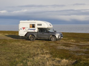 Mobile Camper parked near the Arctic Ocean shore, May, Varanger Fjord, Norway, Europe