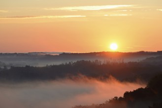 Sunrise, fog rising over the Arnsberg Forest nature park Park, North Rhine-Westphalia, Germany,