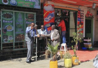 Addis Ababa, in the city centre, locals in front of a snack bar, Ethiopia, Africa