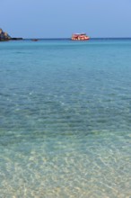 Bathing bay with turquoise water and tourist boat on the holiday island Nang Yuan Island, island,