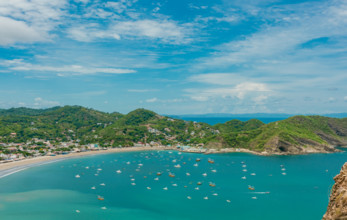 San Juan del Sur bay with ships and boats on the shore. Boats on the shore of the bay of San Juan