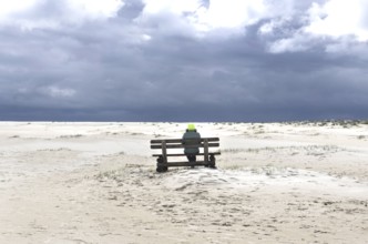 Woman with yellow cap on the beach of Wittdün, Amrum Island, 25.05.2021