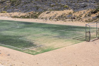 Artificial turf football pitch near the village of Hat, Wadi Nakhar, Arabian Peninsula, Sultanate