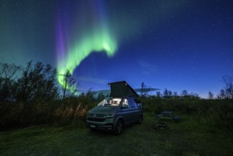 Northern lights over camper, VW California, Lyngen, Troms og Finnmark, Norway, Europe