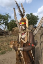 Woman of the Nyangatom ethnic group, also called Bume, in festive dress with body jewellery and