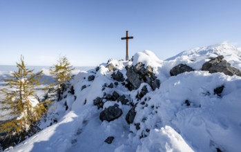 Snow-covered summit of the Jenner with summit cross in autumn, Berchtesgaden National Park,