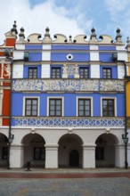 Magnificent Renaissance building with blue façade and ornate decorations under arcades, Great