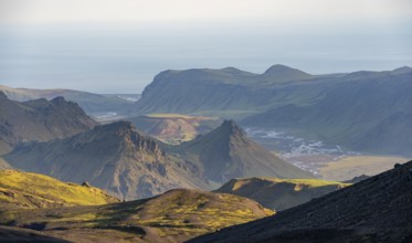 Volcanic mountain landscape overgrown with moss, atmospheric mountain landscape in the evening