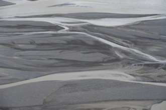 Detail, structure, river course in a gravel bed with black sand, meandering river, Dímonarhellir,