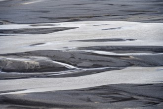 Detail, structure, river course in a gravel bed with black sand, meandering river, Dímonarhellir,