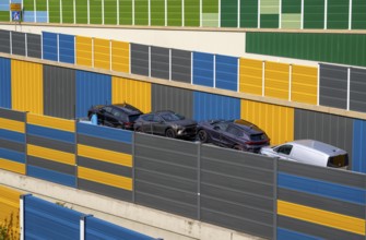 Colourful noise barriers on the A52 motorway, at the Essen-Rüttenscheid junction, the noise