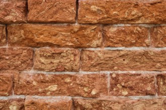 Detail of an old ziggurat wall made of bakestone bricks, Venice Italy