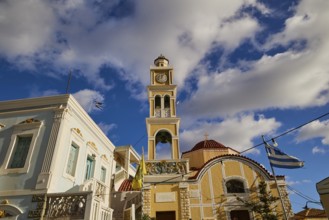 Paraklesio Church, Church tower and surrounding colourful buildings against a beautiful sky,