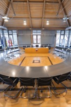 Modern meeting room with round table arrangement and plenty of natural light, Nagold Town Hall,