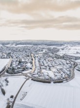 Snow-covered small village surrounded by open fields, Calw- Stammheim, Black Forest, Germany,