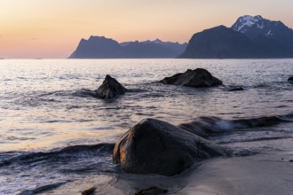 Seascape. On the beach at Myrland. Rocks and sea, with Mount Hogskolmen in the background on the