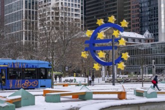 Winter in Frankfurt, euro sculpture at Willy-Brandt-Platz, snow-covered, Hesse, Germany, Europe