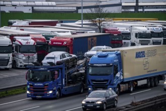 Heavy traffic on the A2 at the Bottrop-Süd service area, overcrowded lorry parking in the evening,