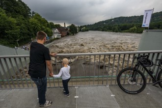 Weir of the Lake Baldeney in Essen, the masses of water roar through the open weirs, high water on