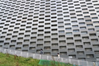 CopenHill, waste incineration plant and artificial ski slope, skiing with a view of the ski lift,