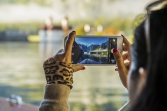 Woman with smartphone, Königssee, Schönau, Berchtesgaden National Park, Berchtesgadener Land, Upper