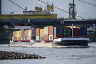 Inland navigation on the Rhine near Duisburg, container ship Hollande, fully loaded, Rhine bridge