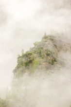 Wisps of mist cover the Karwendel mountains in the Großer Ahornboden nature reserve, Eng Valley,