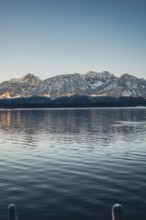 Frosty morning atmosphere during sunrise at Lake Hopfensee in the Allgäu in Bavaria, Germany,