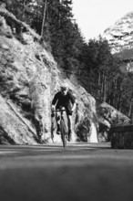 Road bike rider in spring between Lechtal and Tannheimer Tal in front of picturesque scenery of the