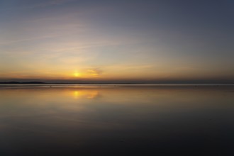 Sunset on a jetty in the Limfjord near Hvalpsund, Denmark, Europe