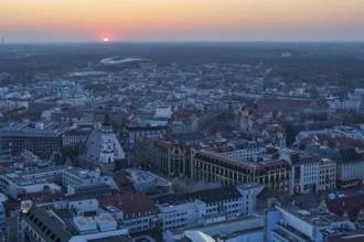 View of the city from the City Tower at sunset, St Thomas' Church, Red Bull Arena and Auwald