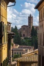 Old town with view of Basilica di San Clemente, historical, building, alley, Siena, Tuscany, Italy,