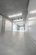 Minimalist, empty concrete interior with modern ceiling lighting, University of Stuttgart, Germany,