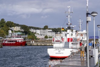 The town harbour of Sassnitz, island of Rügen, excursion boats, behind the old town,