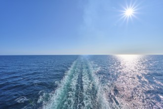 View from the stern of the ship, Mein Schiff 6, onto the fairway, blue sky and bright sunshine,