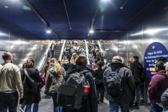 Public transport, underground, main station exit, many people crowding out of the underground