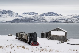 Historic mine railway in winter landscape, Kongsfjord, Ny-Ålesund, Spitsbergen Island, Svalbard and