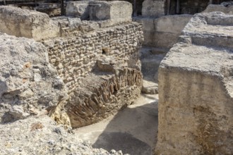 Approaching archaeological ruins with ancient sandstone walls, Jerez