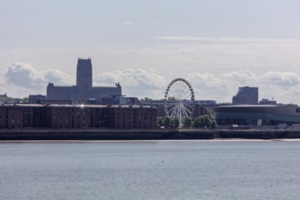 Riverside with a Ferris wheel and a church in the background, Liverpool