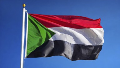 Flags, the national flag of Sudan flutters in the wind