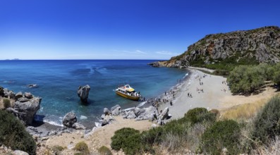 Excursion boat at Preveli Beach at the end of the Kourtaliatiko Gorge, south coast, Crete, Greece,