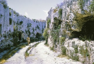 Rock cut tombs behind the theatre, fifth century BC, Greek Theatre at Syracuse, Sicily, Italy,