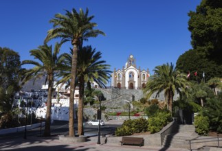 Village square with palm trees and church in Santa Lucía de Tirajana, Gran Canaria, Canary Islands,