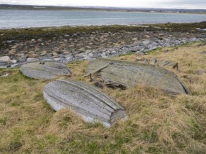 Derelict fishing boats on the shore of the Arctic Ocean, beside the fishing village of Ekkeroy,